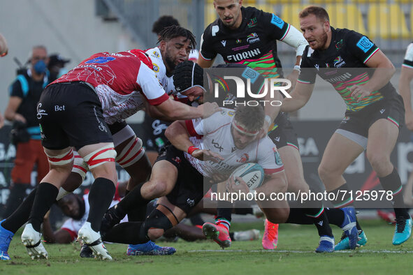 Carlu Sadie (Lions) is tackled by Luca Bigi (Zebre) during the United Rugby Championship match Zebre Rugby Club vs Emirates Lions on Septemb...