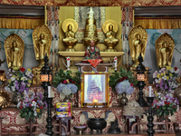 Sacred items and statues adorn the shrine in the Nipponzan Myohoji Buddhist Temple in Darjeeling, West Bengal, India. (