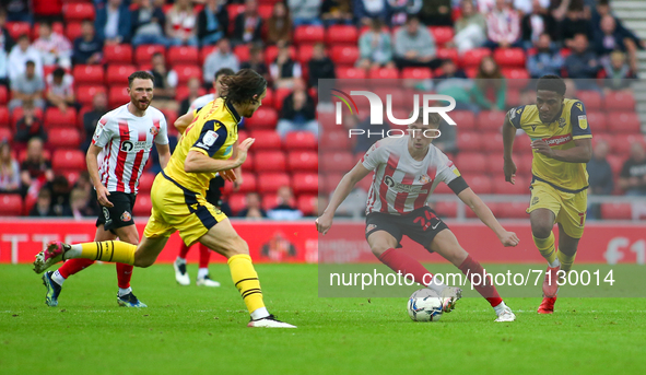 Sunderland's Daniel Neil takes on the Bolton defence during the Sky Bet League 1 match between Sunderland and Bolton Wanderers at the Stadiu...