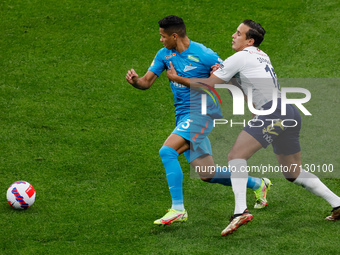 Douglas Santos (L) of Zenit and Mehdi Zeffane of Krylia Sovetov vie for the ball during the Russian Premier League match between FC Zenit Sa...