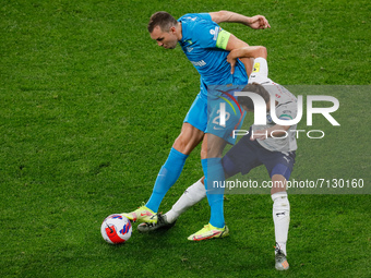 Artem Dzyuba (L) of Zenit and Aleksander Soldatenkov of Krylia Sovetov vie for the ball during the Russian Premier League match between FC Z...