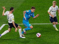 Danil Krugovoy (C) of Zenit vies for the ball with Nikita Chernov (L) and Sergey Piniaev of Krylia Sovetov during the Russian Premier League...