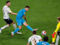 Danil Krugovoy (C) of Zenit shoots on goal as Nikita Chernov (L) and Ivan Lomaev (R) of Krylia Sovetov defend during the Russian Premier Lea...