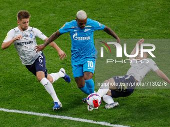 Malcom (C) of Zenit vies for the ball with Iuriy Gorshkov (L) and Denis Yakuba of Krylia Sovetov during the Russian Premier League match bet...