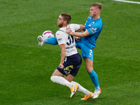 Dmitri Chistyakov (R) of Zenit and Ivan Sergeev of Krylia Sovetov vie for the ball during the Russian Premier League match between FC Zenit...