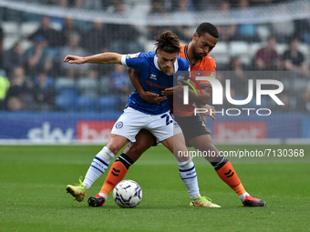 Oldham Athletic's Jordan Clarke tussles with Danny Cashman of Rochdale AFC during the Sky Bet League 2 match between Rochdale and Oldham Ath...