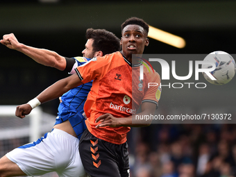 Oldham Athletic's Dylan Fage tussles with Corey O'Keeffe of Rochdale AFC during the Sky Bet League 2 match between Rochdale and Oldham Athle...