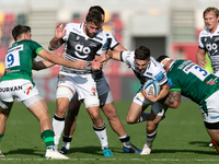 Will Cliff of Sale Sharks is tackled by Marcel Van Der Merwe of London Irish during the Gallagher Premiership match between London Irish and...