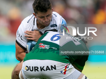 Kieran Wilkinson of Sale Sharks is tackled by Matt Rogerson of London Irish during the Gallagher Premiership match between London Irish and...