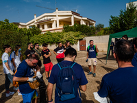 Volunteers of the Terrae Association organize themselves before cleaning up the green lung of the city Lama Martina during the national Plas...