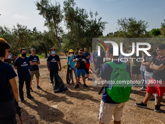 Volunteers of the Terrae Association organize themselves before cleaning up the green lung of the city Lama Martina during the national Plas...