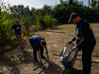 Volunteers of the Terrae Association clean up the green lung of the city Lama Martina during the National Plastic Free Day in Molfetta on Se...
