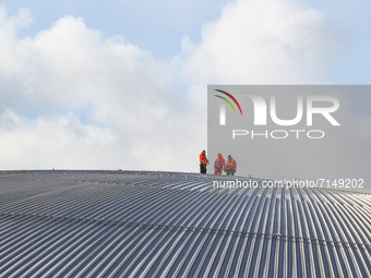 A general view of workers on the roof of the SSE Hydro located on the Scottish Event Campus on September 29, 2021 in Glasgow, Scotland. The...