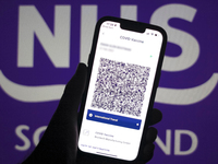 Scotlands Vaccine Passport App is seen on a smartphone screen with the Scottish NHS logo in the background in this illustration photo taken...