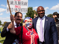 Congressmen Chuy Garcia (D-IL) and Jamaal Bowman (D-NY) take a photo with CASA board member Ivania Castillo at a protest at the US Capitol,...