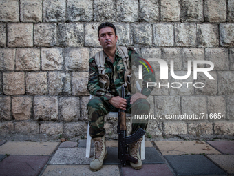 A Peshmerga soldier keeps watch in the streets of Dohuk / Summer 2013.  (