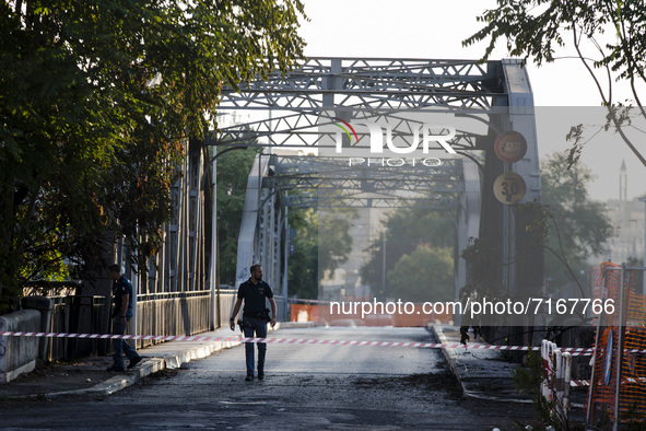 Italy, Rome: Policemen inspect Ponte dell' Industria , also know as 'Ponte di Ferro' (iron bridge) which burned down for reasons yet to be v...