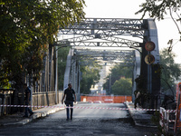 Italy, Rome: Policemen inspect Ponte dell' Industria , also know as 'Ponte di Ferro' (iron bridge) which burned down for reasons yet to be v...