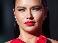Model Adriana Lima wearing a Magda Butrym dress arrives at the World Premiere Of Sony Pictures' 'Once Upon a Time In Hollywood' held at the...