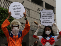 Environmental activists take action wearing Japanese character costumes in front of the Japanese Embassy, Jakarta, on October 4, 2021. The a...