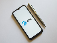 In this photo illustration an AT&T logo is display on a smartphone screen and a pencil in Athens, Greece on October 4, 2021. (