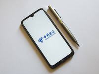 In this photo illustration a China Telecom logo is display on a smartphone screen and a pencil in Athens, Greece on October 4, 2021. (