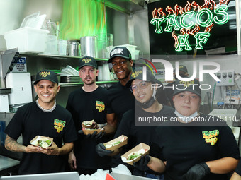 Tacos AF Co-Owner Brandon Thompson and American professional basketball player Rajon Rondo attend the National Taco Day With Los Angeles Lak...