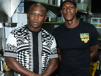 Rapper O.T. Genasis and American professional basketball player Rajon Rondo attend the National Taco Day With Los Angeles Lakers Star Rajon...
