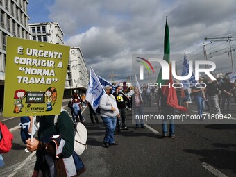 Activists from the teachers' union display banners in support of teachers' welfare demands during a march in Lisbon. 05 October 2021. The Po...