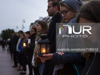 Group of activists and citizens gathered in Warsaw Old Town in a mourning ceremony for refugees who died on Polish border recently, in Warsa...