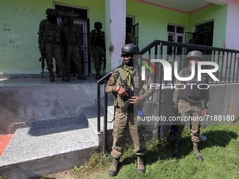 SRINAGAR, KASHMIR, INDIA-OCTOBER 07: Indian soldiers stand outside the school building where two teachers were shot dead by gunmen including...