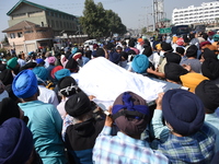 Sikh mourners carry the dead body of the slain school principal Supinder Kaur in Srinagar, Indian Administered Kashmir on 8 October 2021. Tw...