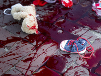 Group of activists spilled blood and dropped baby toys in front of Polish Parliment, in a protest against anti-migration activities ordered...