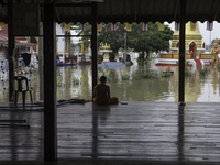 Oct 8, 2021, The monks sat in a temple pavilion that had been flooded due to the monsoon and rain that had been pouring for a week. (