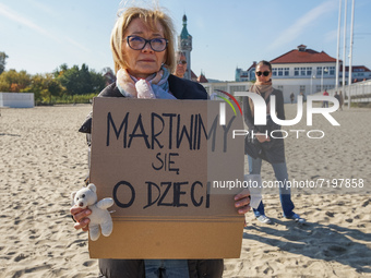 Protester holding 'we care about children' banner are seen in Sopot, Poland on 10 October 2021  People protest under the slogan: Don't take...