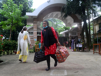 Girl students arrive at Dhaka University as reopen their residential halls after 18 months due to coronavirus emergency in Dhaka, Bangladesh...