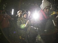 Group of illegal immigrants surrounded by journalists and border guard after crossing polish belarusian border near Michalowo on October 6,...