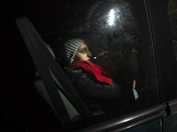 Immigrant woman gest into border guards car after crossing polish belarusian border near Michalowo on October 6, 2021. (
