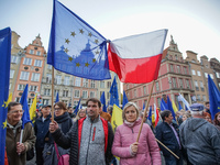 Protesters with EU and Polish flags are seen in Gdansk, Poland on 10 October 2021 People take to the streets around a country to voice oppos...