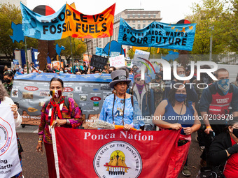 Native American activists lead a protest at the White House against the continued use of fossil fuels on Indigenous Peoples' Day, the first...