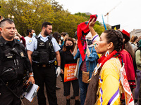 Native American activists are confronted by US Park Police in a civil disobedience action at the White House against the continued use of fo...