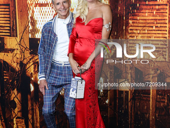 CEO of Miramax Bill Block and Eugenia Kuzmina arrive at the Costume Party Premiere Of Universal Pictures' 'Halloween Kills' held at the TCL...