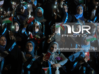 Palestinian students from al-Azhar University attend their graduation ceremony, in Gaza city on October 12, 2021.  (