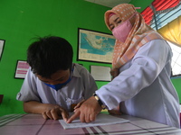A number of students with disabilities participate in limited face-to-face learning at the Special School of SLB ABCD Muhammadiyah in Palu,...