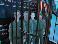 Imprisoned dolls of Israeli soldiers captured by Hamas are seen in Gaza City, on October 13, 2021. (