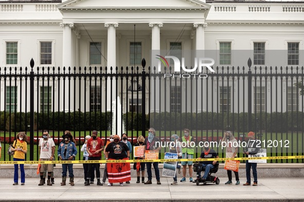 Native American climate activists and allies are arrested at the White House during a civil disobedience action against the continued use of...