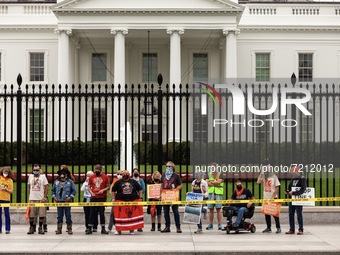Native American climate activists and allies are arrested at the White House during a civil disobedience action against the continued use of...