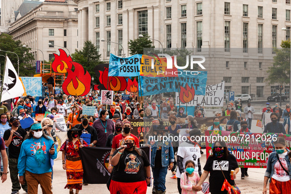Native American climate activists and allies march to are the White House to protest against the continued use of fossil fuels, on the third...