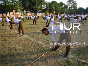 RSS ( Rashtriya swayam sevak sangh ) volunteers perform physical exercise on the eve of Vijayadashmi ( Dussehra ) festival , in Allahabad on...