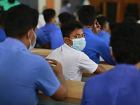 School students sit at Colonel Malek Medical College Hospital to receive a dose of the Covid-19 coronavirus vaccine as trial run vaccination...